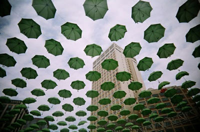 Green Umbrellas Rainy Sky