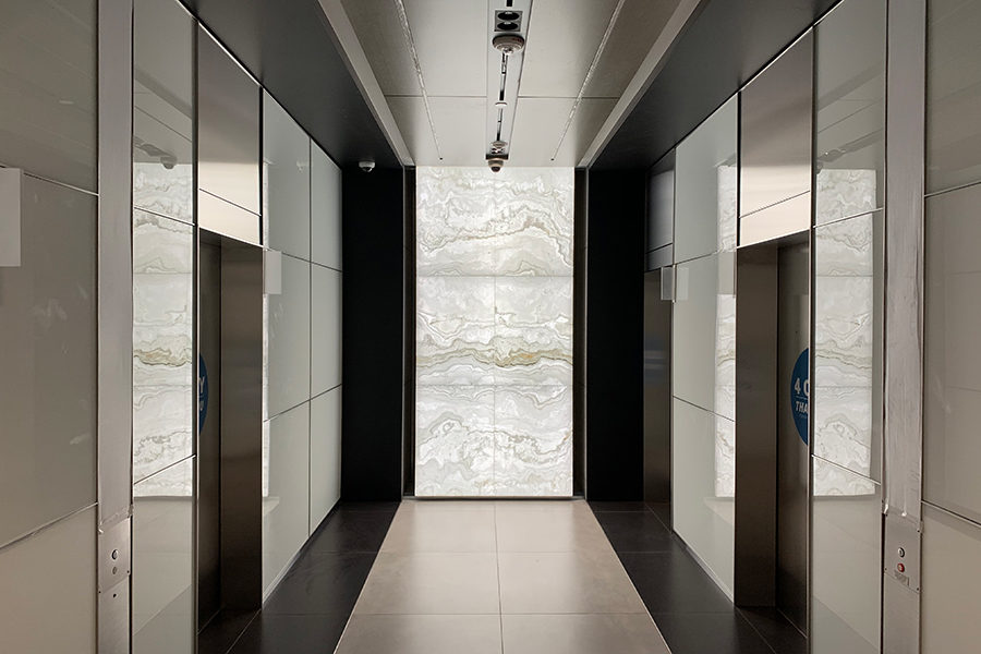 Backlit Onyx Elevator Lobby Walls