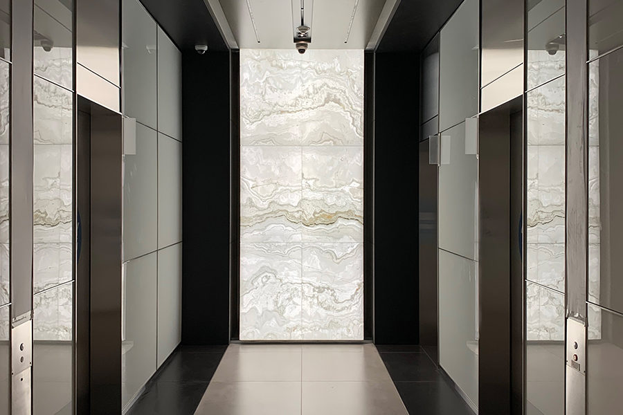 Backlit Onyx Elevator Lobby Walls