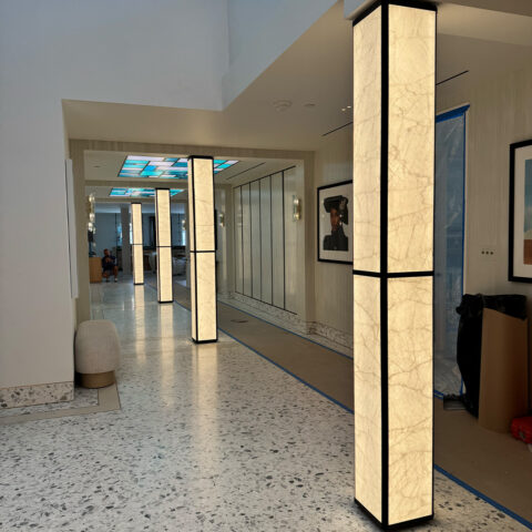 Four Glass Backed Illuminated Columns